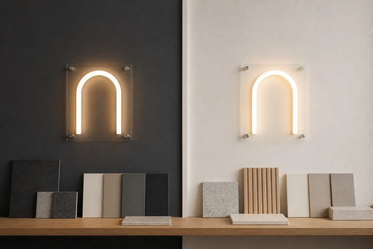 Identical warm white LED neon arches compared on charcoal and off-white wall panels