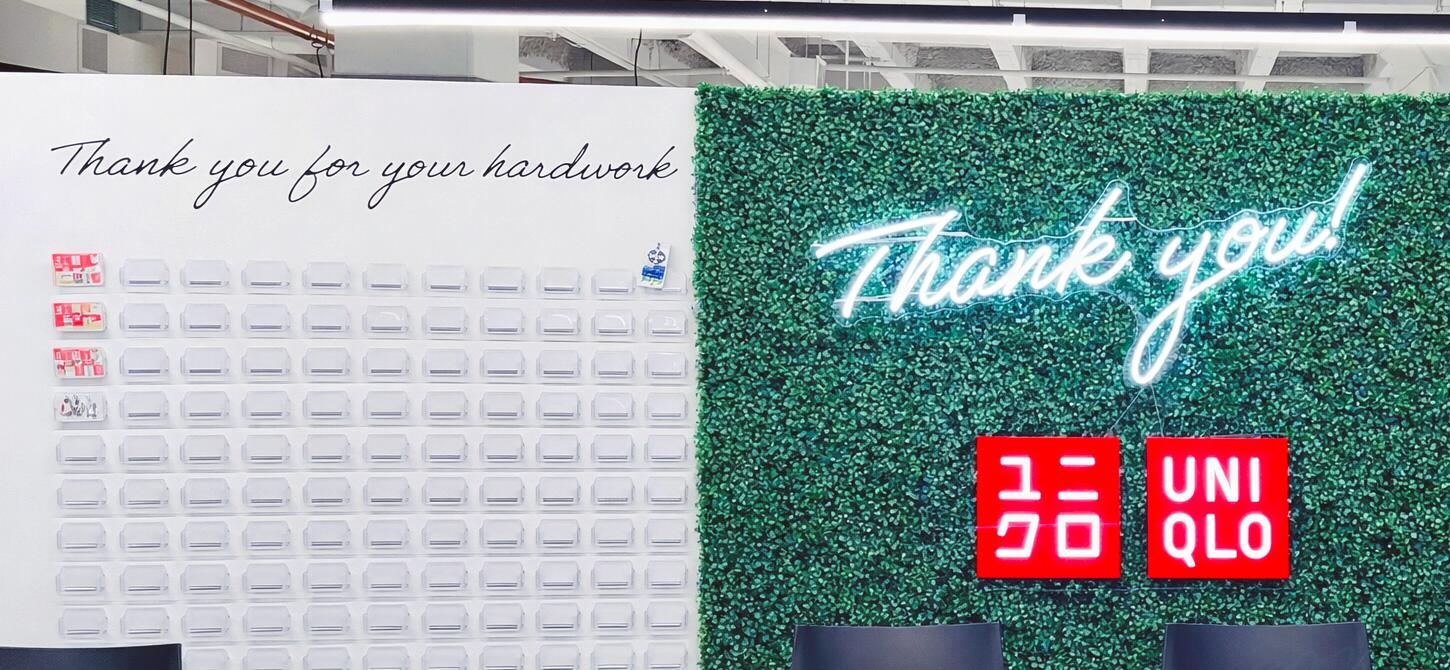 Custom LED neon logo sign in a branded business space