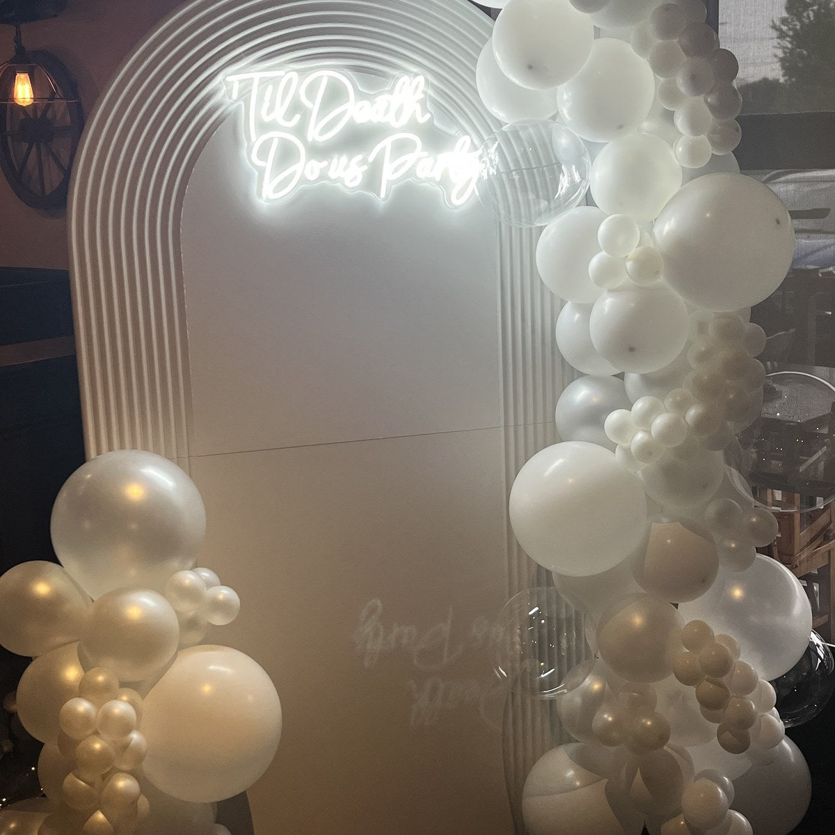 White event backdrop with custom neon sign in Canada
