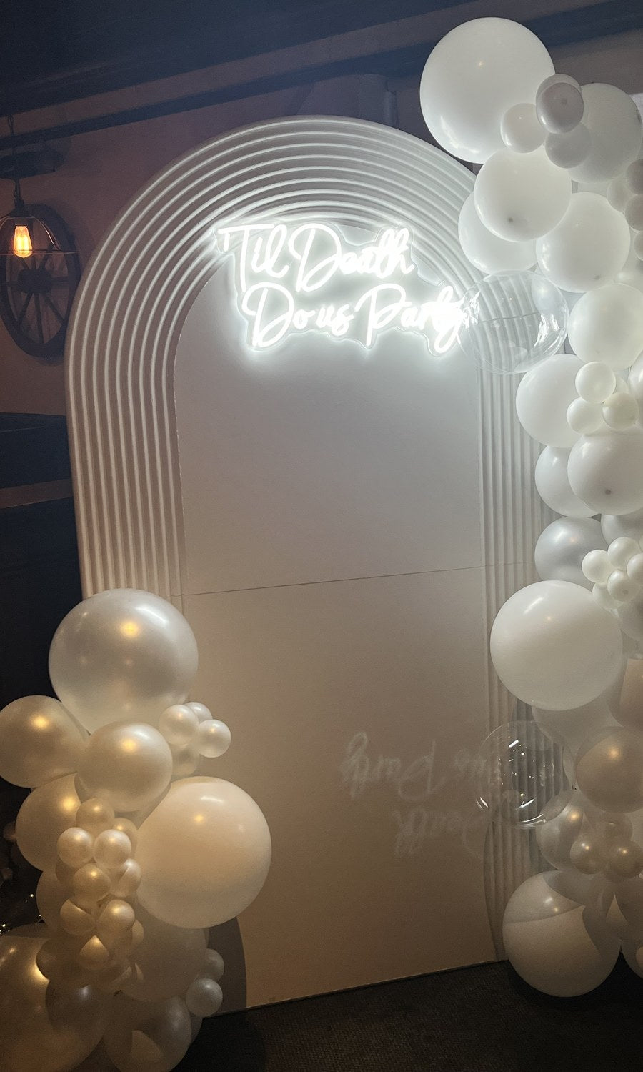 White event backdrop with custom neon sign