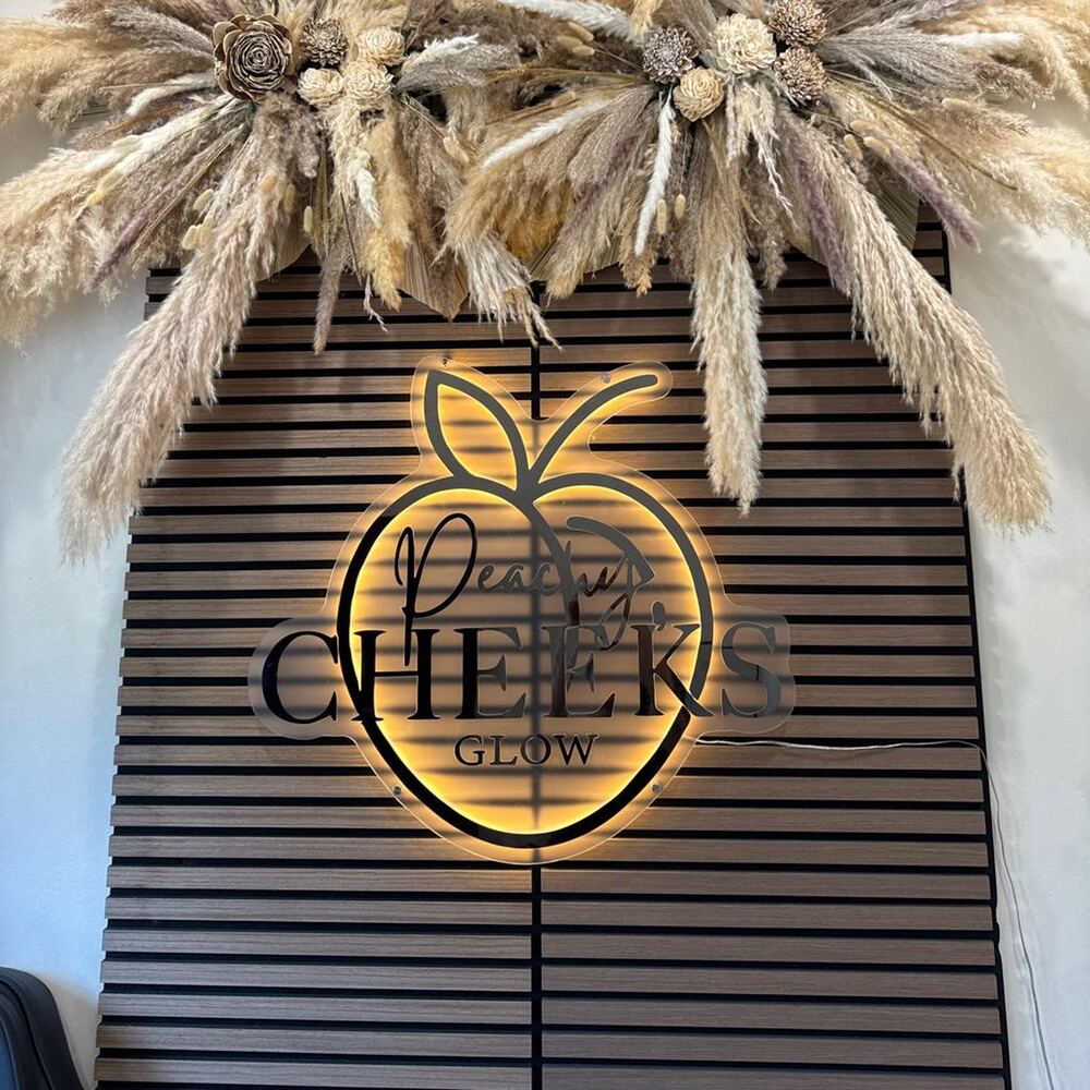 Peachy Cheeks backlit custom neon sign in Canada