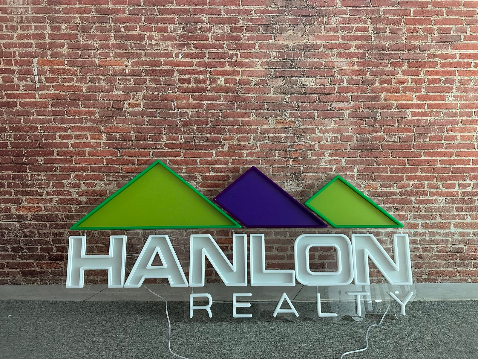 Completed Hanlon Realty logo sign before installation