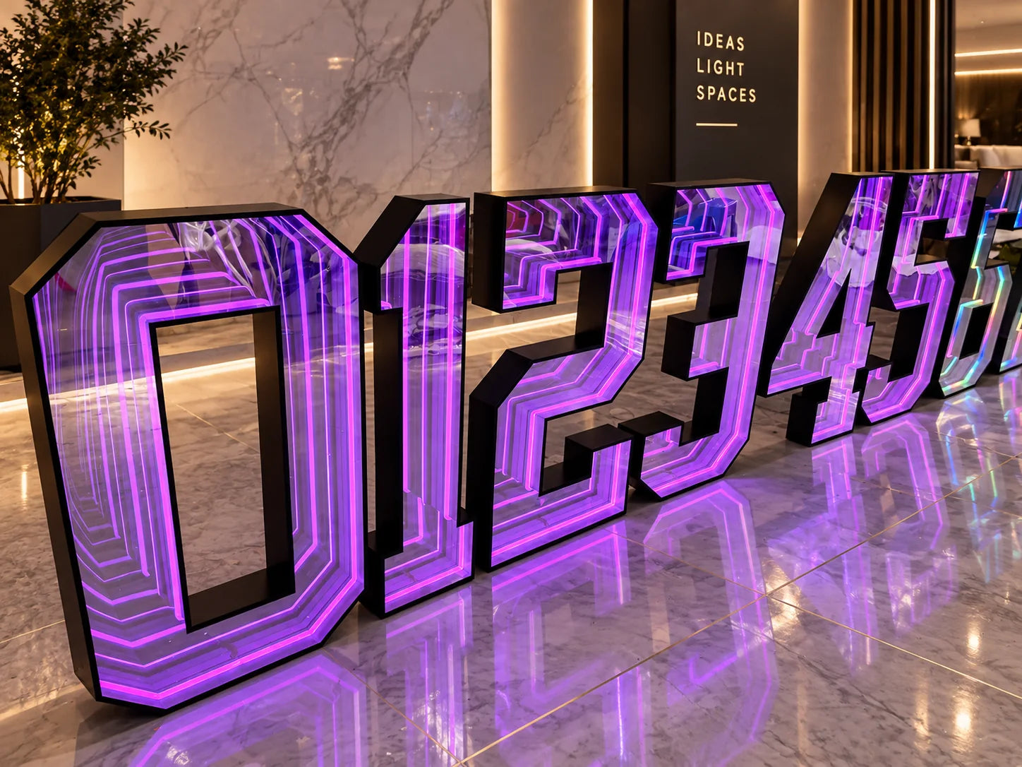 Purple infinity mirror channel letters with a repeating LED tunnel effect