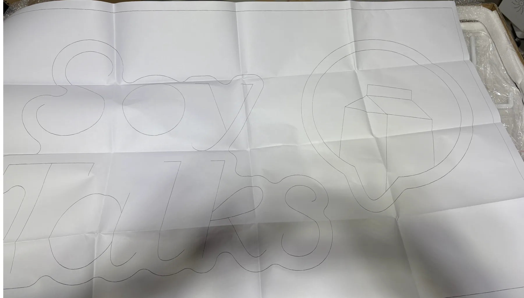 Full-size positioning template supplied with the Soy Talks neon sign