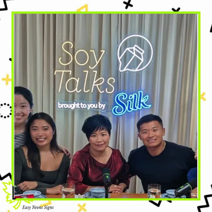 Soy Talks podcast panel with a custom Silk sponsor LED neon sign